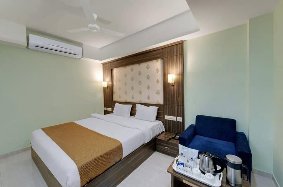 Hotel Shital Inn Deluxe Double Bed Room with seating and in-room tea station